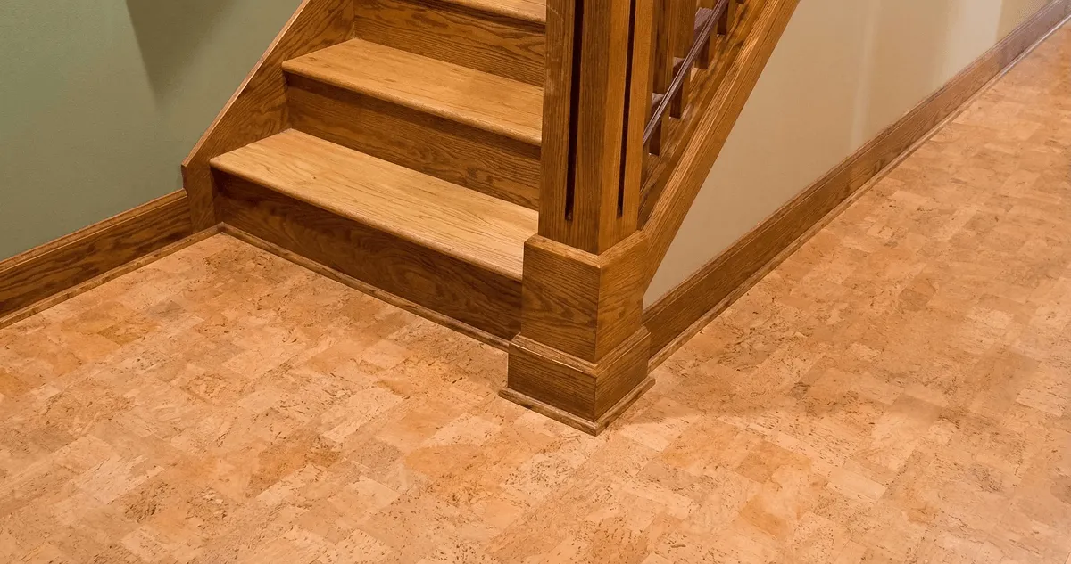 End of a staircase with cork flooring in Fort Worth, TX