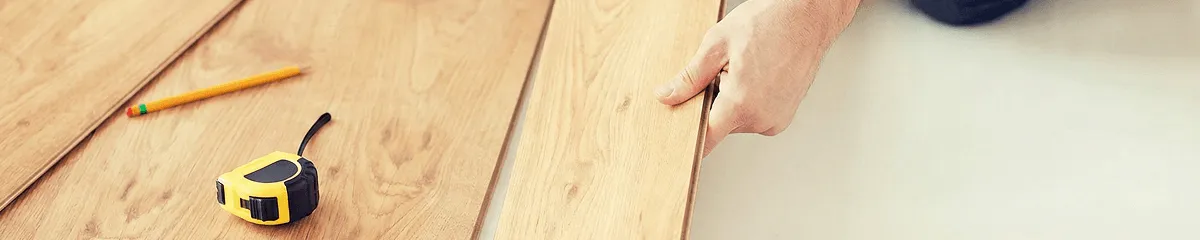 A professional installing wood flooring in Fort Worth, TX