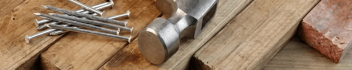 Hammer and nails on hardwood flooring boards in Fort Worth, TX