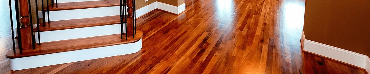 Base floor of a staircase with professionally restored wood flooring in Fort Worth TX