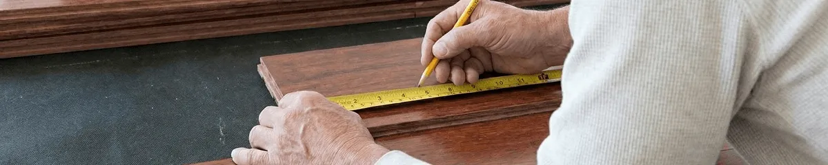 A professional installing wood flooring in Fort Worth, TX