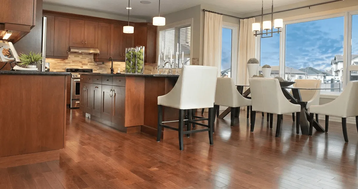 A modern kitchen with professionally installed wood flooring in Fort Worth, TX